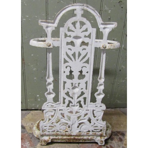 1049 - A small painted cast iron umbrella stand with decorative pierced foliate back over a removable drip ... 