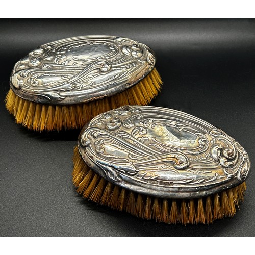 199 - An assortment of six silver backed brushes and a single silver hand mirror (7)