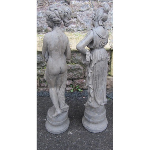 1064 - Two small cast composition stone garden/interior ornaments in the form of classical maidens in varyi... 