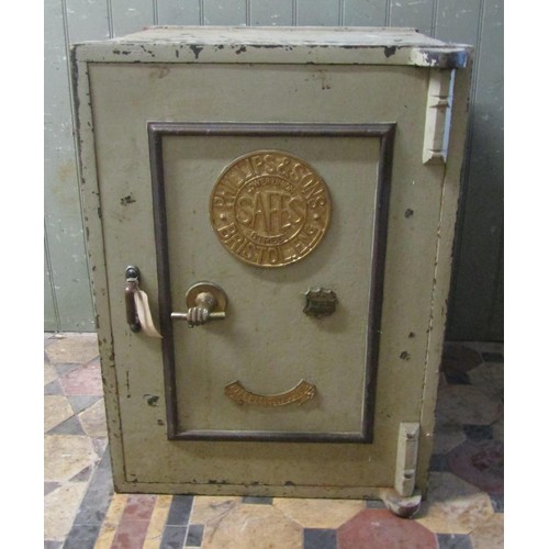 1067 - A large Phillips & Sons, Bristol fire resisting safe enclosed by a single door with brass fittings a... 