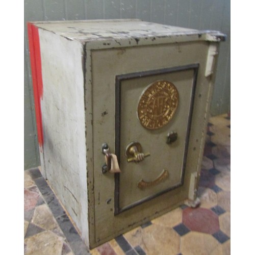 1067 - A large Phillips & Sons, Bristol fire resisting safe enclosed by a single door with brass fittings a... 