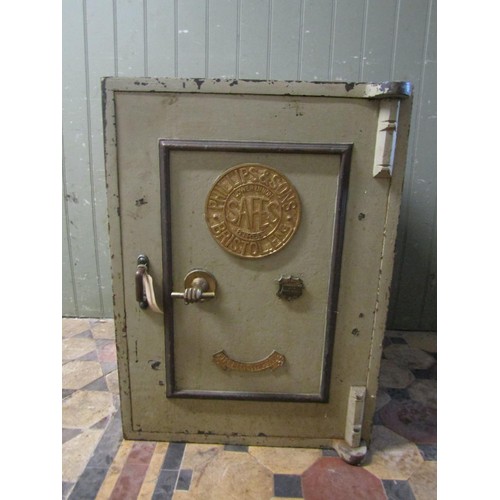 1067 - A large Phillips & Sons, Bristol fire resisting safe enclosed by a single door with brass fittings a... 