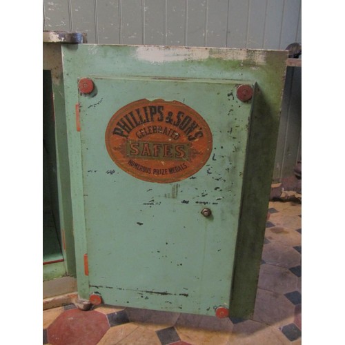 1067 - A large Phillips & Sons, Bristol fire resisting safe enclosed by a single door with brass fittings a... 