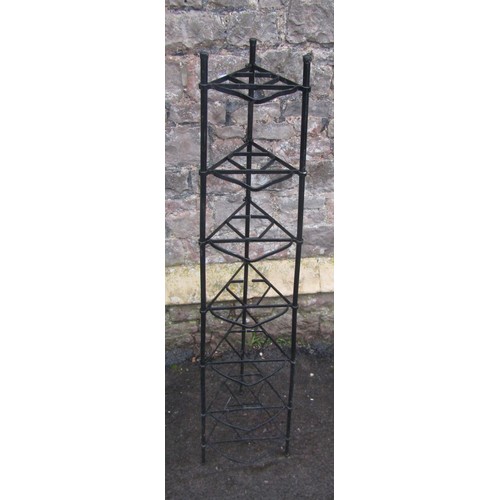 1068 - A light painted steel saucepan stand on seven graduated tiers 138 cm (full height)