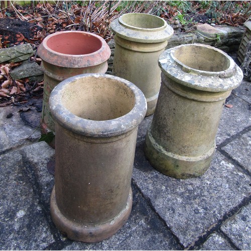 1025 - Four weathered chimney pots, slight variation in height and design, 47cm tall max (af)