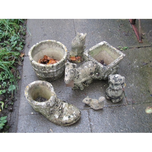 1024 - Three small weathered novelty garden planters to include a donkey pulling a cart, and old boot, a fu... 