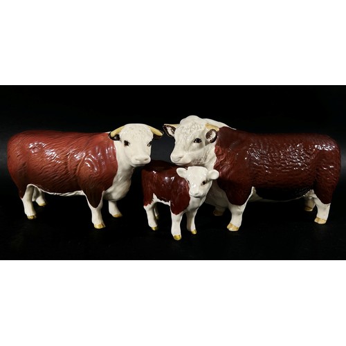 64 - A Beswick group of a Hereford bull, cow and calf (3)