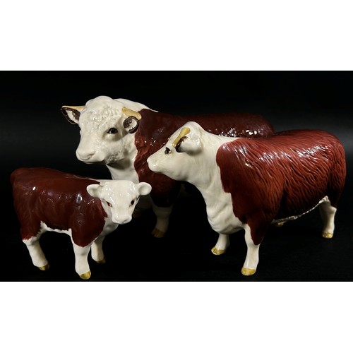 64 - A Beswick group of a Hereford bull, cow and calf (3)