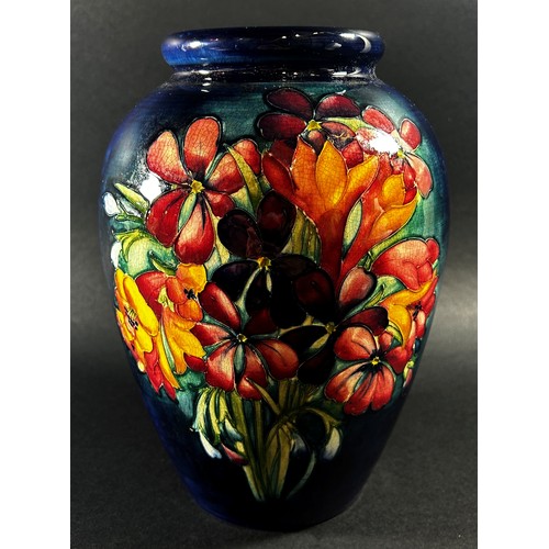 114 - A Moorcroft floral porcelain vase, signed to underside