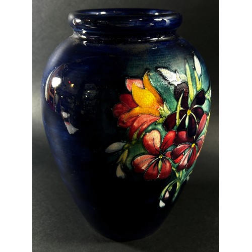 114 - A Moorcroft floral porcelain vase, signed to underside