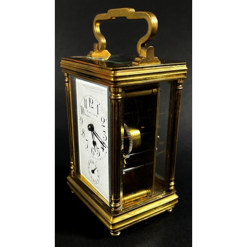 443 - A late 19th century brass carriage clock with eight day striking movement, currently running