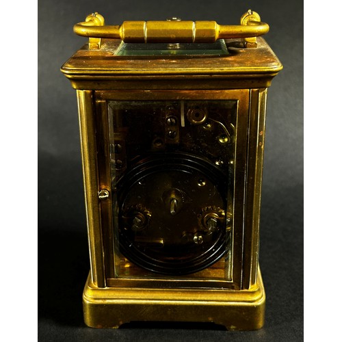 440 - A brass carriage clock with eight day striking movement with repeat, currently running