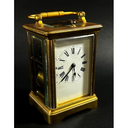 440 - A brass carriage clock with eight day striking movement with repeat, currently running