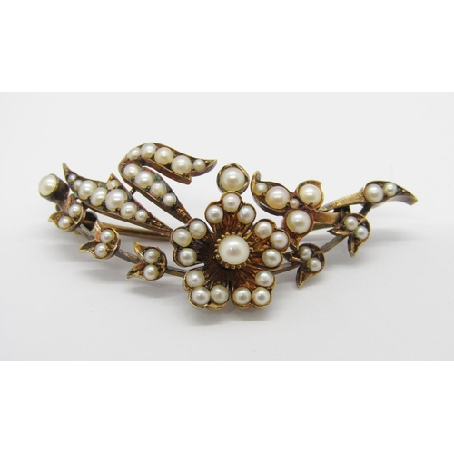 231 - Antique yellow metal floral spray brooch set with pearls, 5.2cm W approx, 10.7g