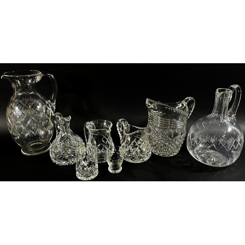 140 - A mixed selection of 19th and 20th century glassware including decanters, jugs, sets of matching gla... 