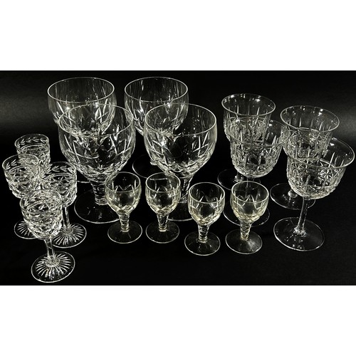 142 - A suite of matching Georgian style star cut glasses  including red and white wine glass, cordial, sh... 