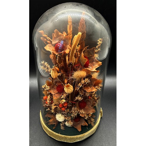 540 - A dried flower arrangement in glass dome display, a pair of porcelain powder tubes, a small magnifyi... 