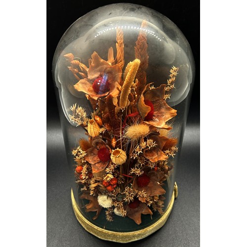 540 - A dried flower arrangement in glass dome display, a pair of porcelain powder tubes, a small magnifyi... 