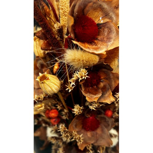 540 - A dried flower arrangement in glass dome display, a pair of porcelain powder tubes, a small magnifyi... 