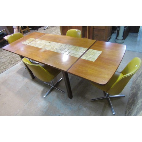 1146 - A mid 20th century G plan teakwood extending drop leaf table , the central section enclosing ceramic... 