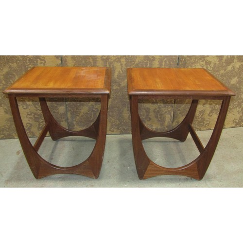 1169 - A pair of G plan teakwood occasional tables of square cut form on horseshoe shaped supports