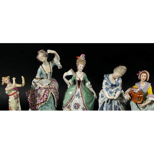 99 - A mixed collection of continental porcelain figure groups, some in an 18th century style including m... 