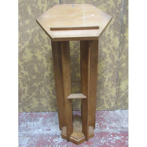 1077 - An unusual lectern in oak, the hexagonal top raised on six shaped supports