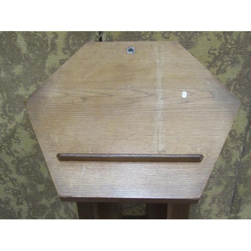 1077 - An unusual lectern in oak, the hexagonal top raised on six shaped supports