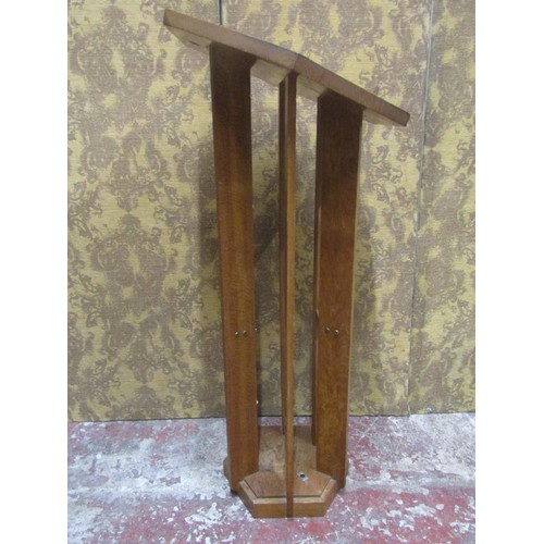 1077 - An unusual lectern in oak, the hexagonal top raised on six shaped supports