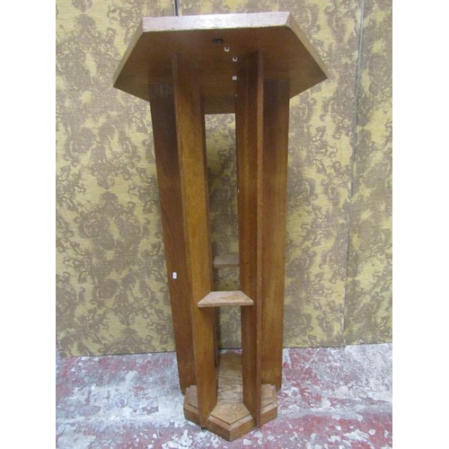 1077 - An unusual lectern in oak, the hexagonal top raised on six shaped supports