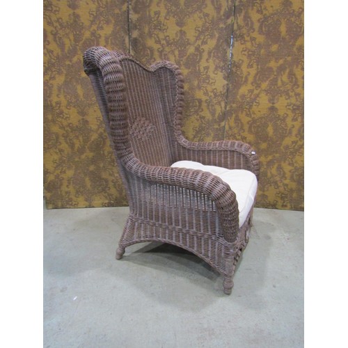 1118 - A Victorian style wicker conservatory/veranda chair, winged framework enclosing decorative panels