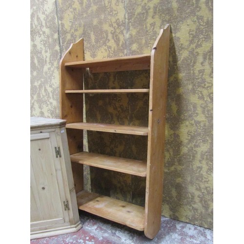 1081 - A stripped and waxed pine hanging corner cupboard with panelled door, a flight of open shelves and a... 