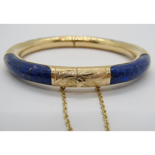 247 - 14k lapis lazuli hinged bangle with engraved detail and heart shaped push clasp, 7cm diameter approx... 