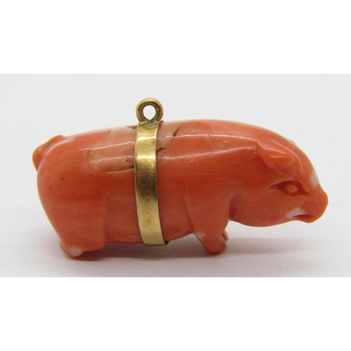 284 - Yellow metal mounted carved coral pig charm, 3cm L approx, 8.4g (back legs af)