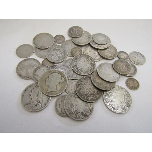 873 - A collection of Victorian silver coinage to include half crowns, florins, shillings, and smaller coi... 