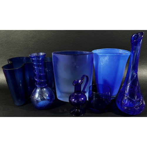 149 - A collection of eight Bristol Blue glassware vases in varying designs.