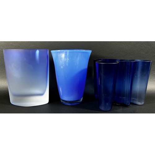 149 - A collection of eight Bristol Blue glassware vases in varying designs.