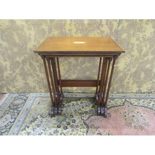 A nest of three Edwardian mahogany occasional tables in the Georgian style with chequer string borders, inlaid panels and raised on turned supports, 70cm high, 60 x 40cm
