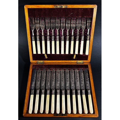 150 - A small oak canteen of cutlery complete for six settings, together with a cased set of fish knives a... 