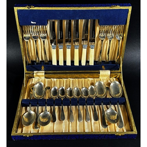 150 - A small oak canteen of cutlery complete for six settings, together with a cased set of fish knives a... 