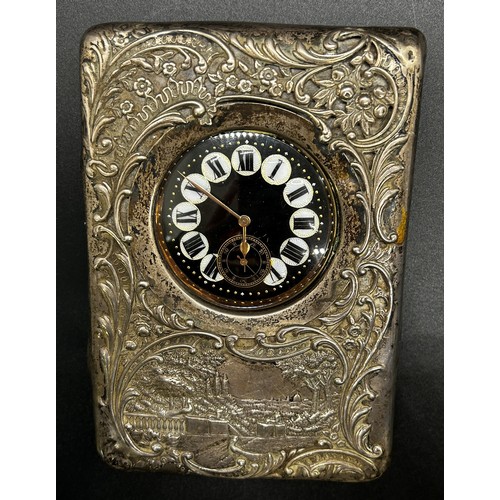 178 - A late Victorian silver watch case with a country house scene and scrolled detail, Birmingham 1899, ... 