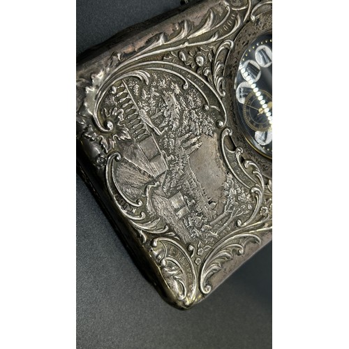 178 - A late Victorian silver watch case with a country house scene and scrolled detail, Birmingham 1899, ... 