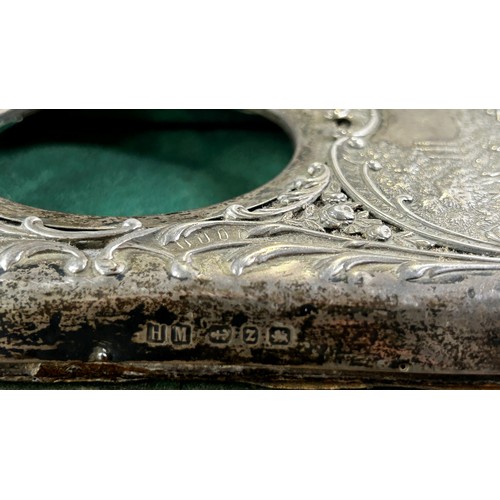 178 - A late Victorian silver watch case with a country house scene and scrolled detail, Birmingham 1899, ... 