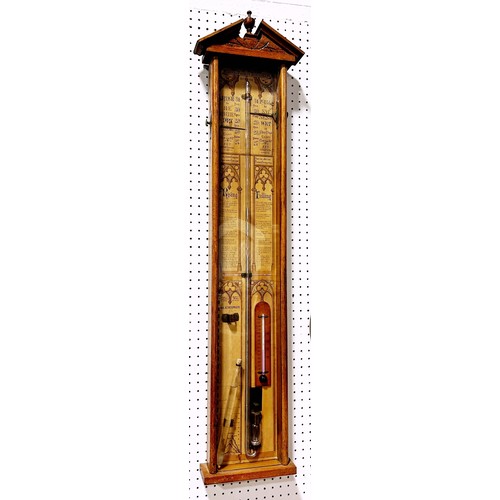 466 - A 19th century Admiral Fitzroy barometer with oak case, the back plate with printed detail and Gothi... 