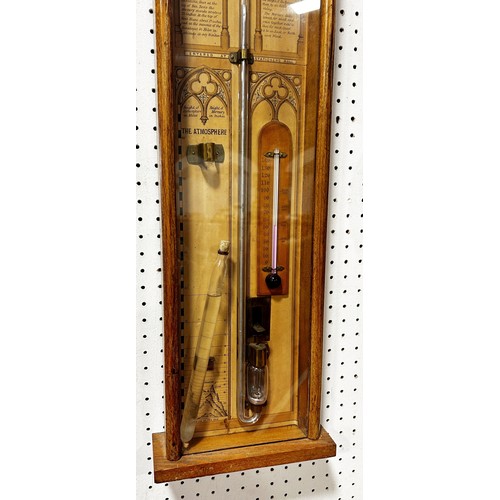 466 - A 19th century Admiral Fitzroy barometer with oak case, the back plate with printed detail and Gothi... 