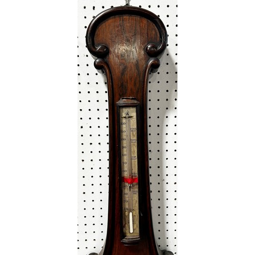 467 - A mid-19th century rosewood barometer with silvered dials and further applied carving by W. Johnson ... 