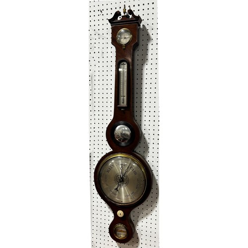 468 - A Georgian mahogany wheel barometer with silvered dials, swan neck pediment by Stowbridge of Dawlish... 