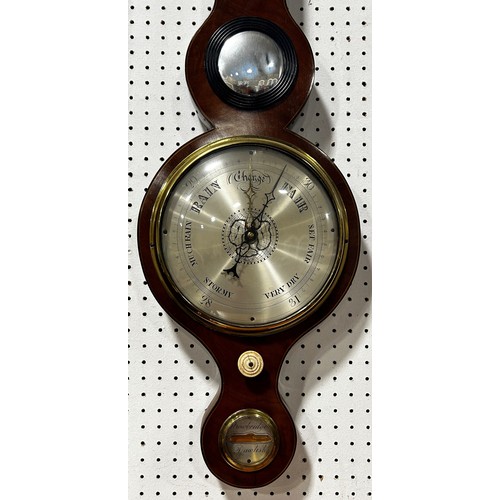 468 - A Georgian mahogany wheel barometer with silvered dials, swan neck pediment by Stowbridge of Dawlish... 