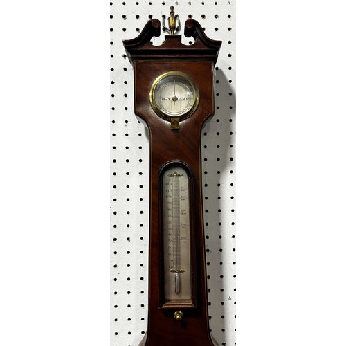 468 - A Georgian mahogany wheel barometer with silvered dials, swan neck pediment by Stowbridge of Dawlish... 