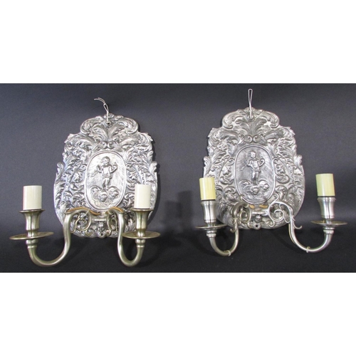 471 - Four 18th century continental style wall sconces decorated with cherubs and foliate scrolling each h... 